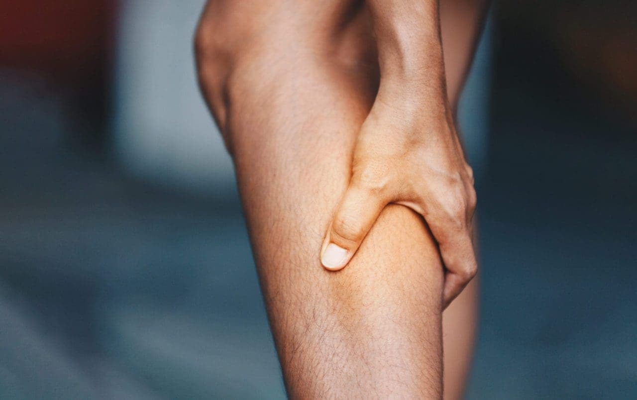 closeup of hand holding a leg