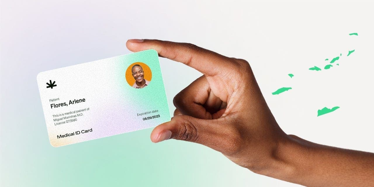 closeup hand holding MMJ card